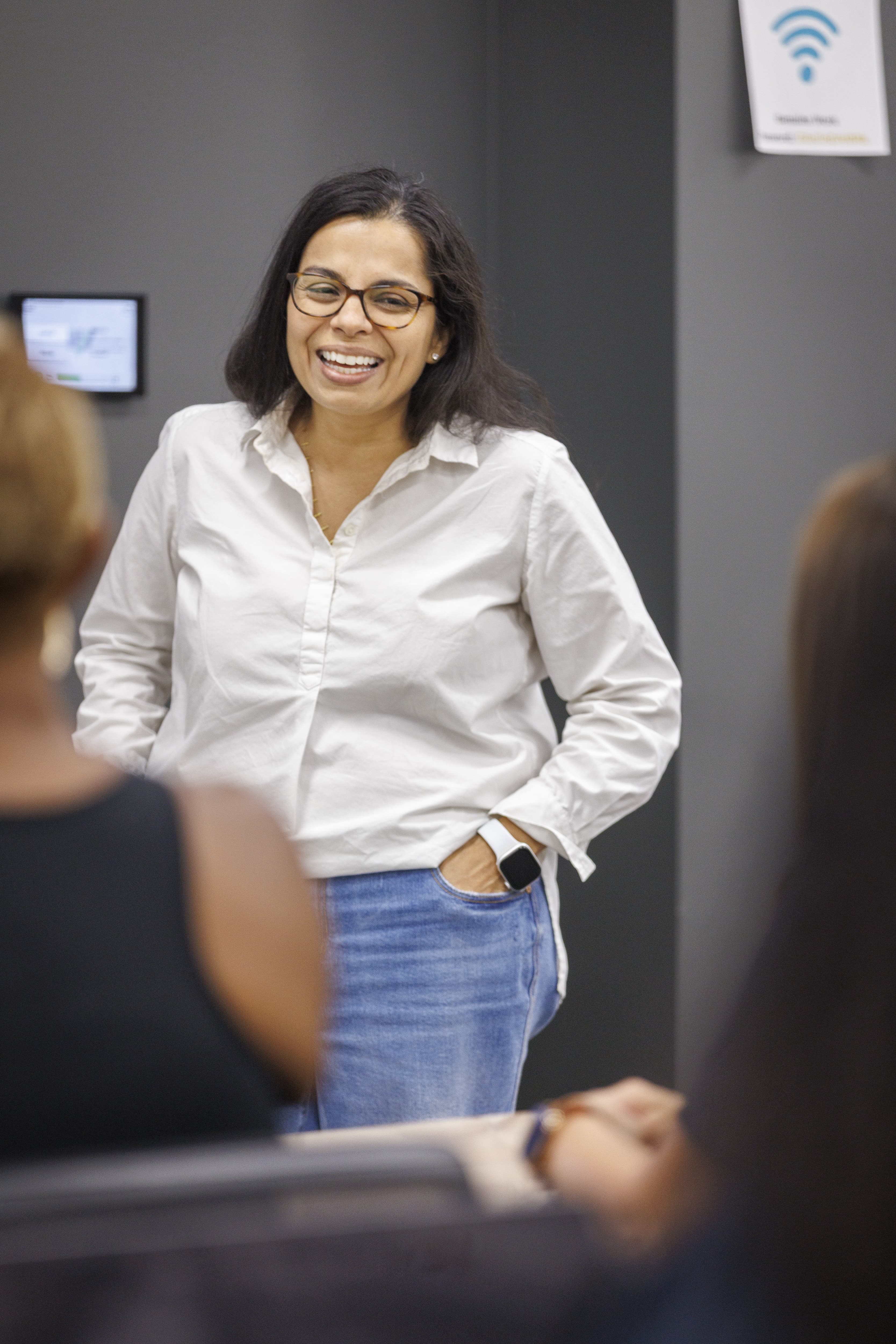 Dr. Mamata Majmundar speaking to a room, photograph by Austin Lopesilvero